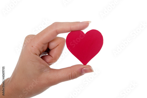 red heart in a womans hand on white background