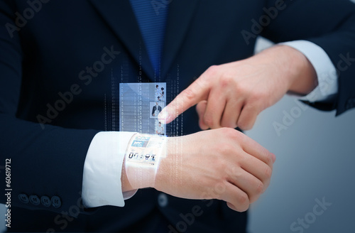 businessman pointing to something at his hand