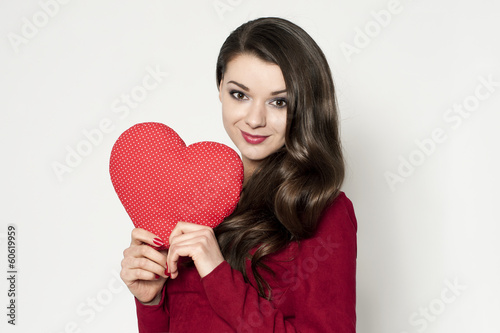 Beautiful brunette woman with red heart © noeemi_fotolia