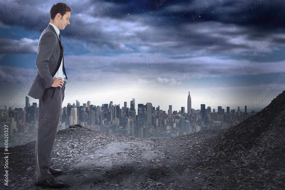 Composite image of smiling businessman with hands on hips Composite image of smiling businessman with hands on hips