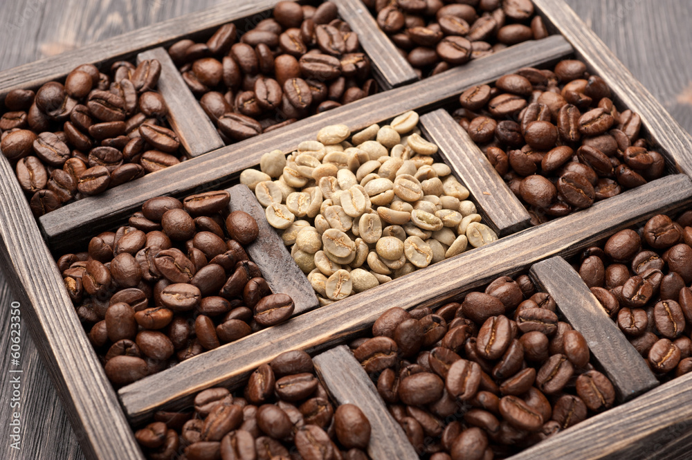 Roasted coffee and green coffee in old wooden box Roasted coffee and green coffee in old wooden box
