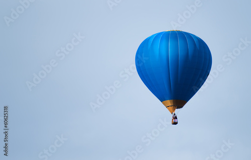 Blue balloon in the blue sky