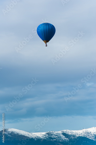 Blue balloon in the blue sky