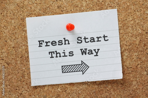 Fresh Start This Way Sign on a cork notice board photo
