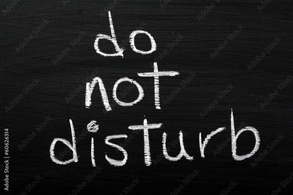 Do Not Disturb sign on a blackboard Do Not Disturb sign on a blackboard