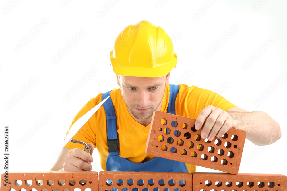 Portrait of young builder isolated on white Portrait of young builder isolated on white