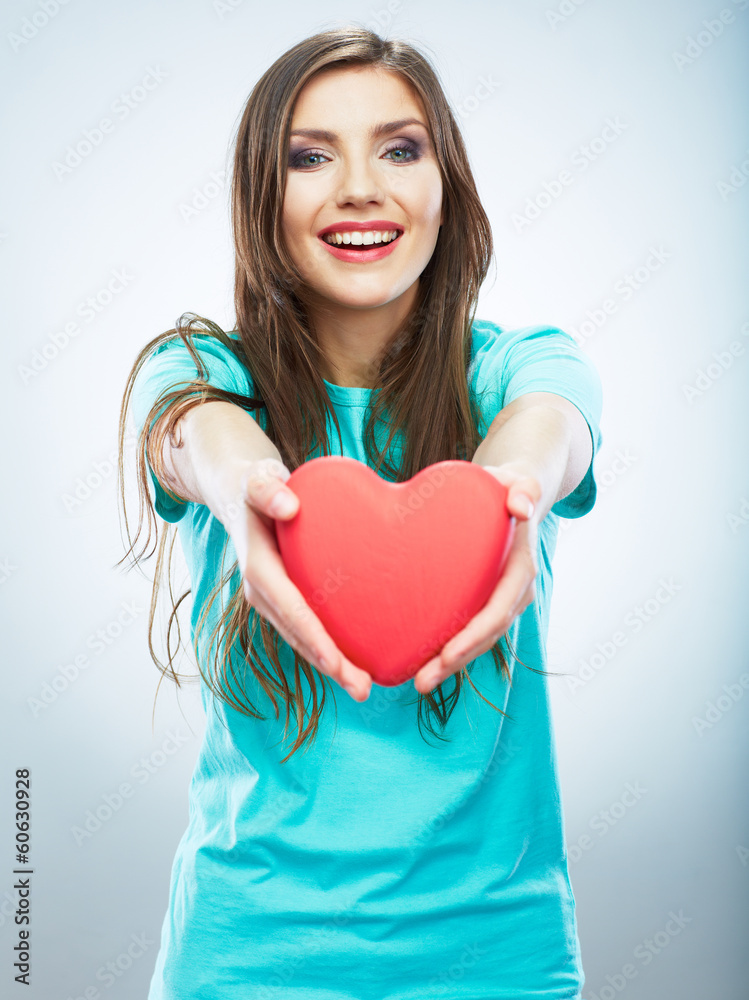 Red heart. Love symbol. Portrait of beautiful woman hold Valent Red heart. Love symbol. Portrait of beautiful woman hold Valent