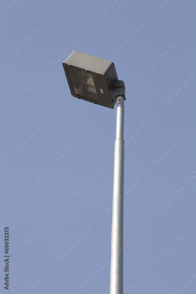 Square spotlight street lighting poleblue sky Square spotlight street lighting poleblue sky