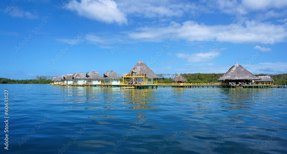 Tropical resort with thatched bungalows