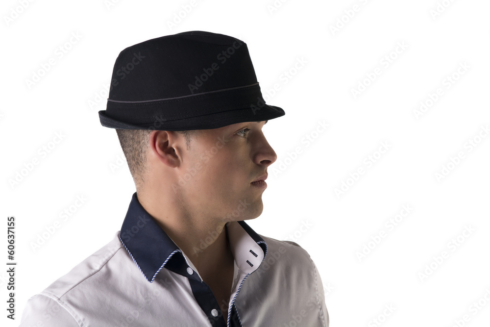 Profile view of attractive young man with fedora and white shirt Profile view of attractive young man with fedora and white shirt
