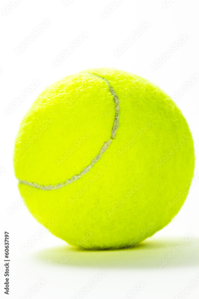 Closeup of tennis ball isolated on white background.