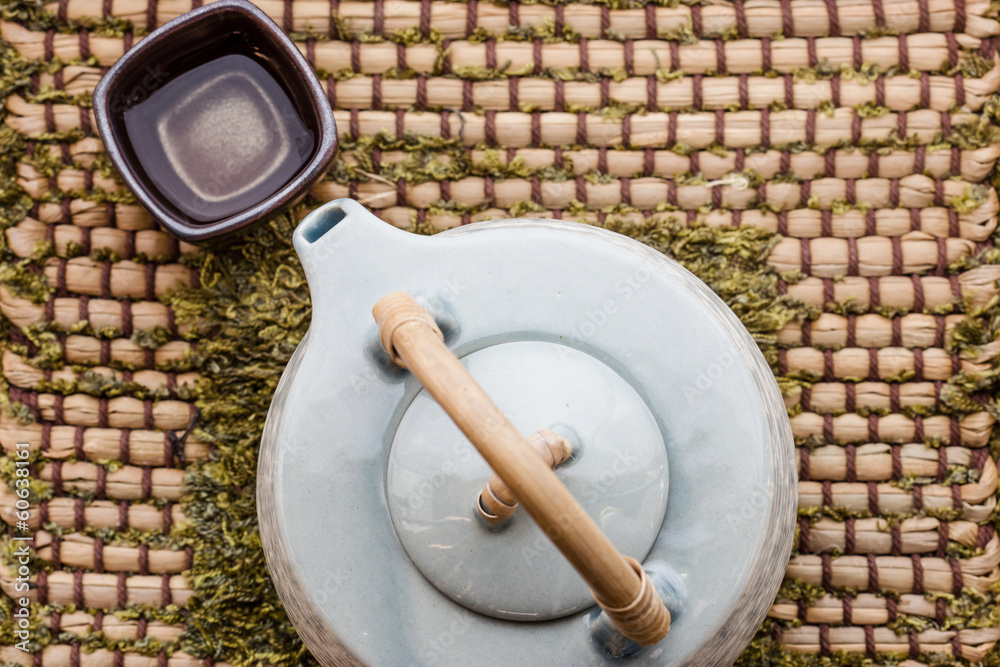Cup of tea and teapot on wooden Cup of tea and teapot on wooden