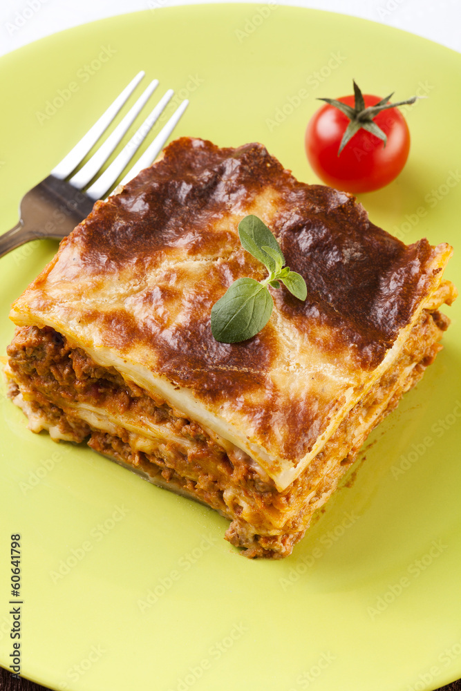 Portion of tasty lasagna on a plate Portion of tasty lasagna on a plate