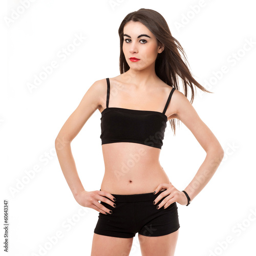 Young woman fitness portrait isolated against white background.