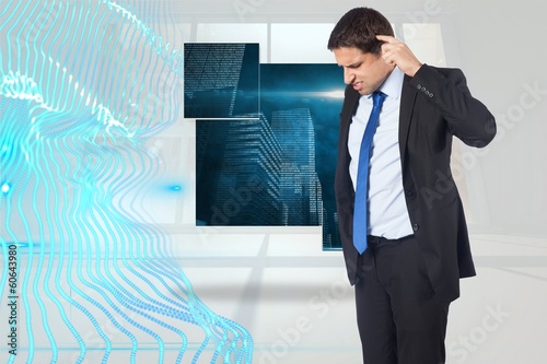 Composite image of thinking businessman scratching head