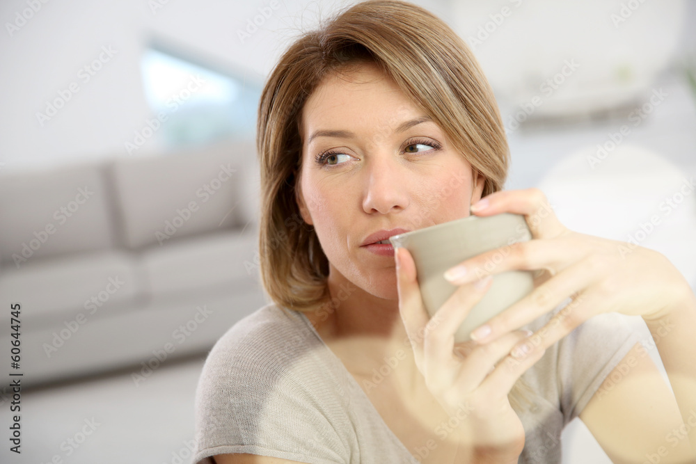 Beautiful woman drinking hot tea Beautiful woman drinking hot tea