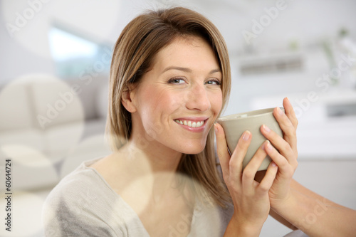Beautiful woman drinking hot tea