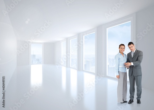Composite image of business partners with clipboard