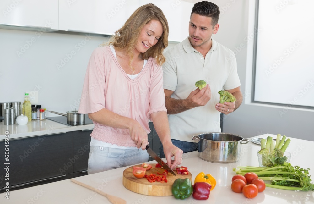 Couple preparing food in kitchen Couple preparing food in kitchen