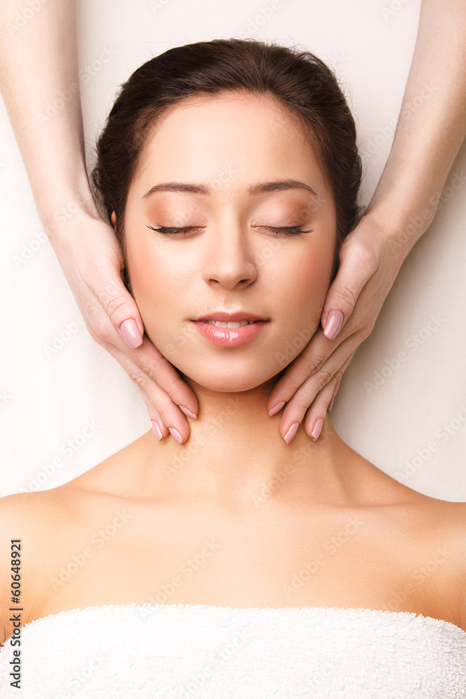 Face Massage. Close-up of a Young Woman Getting Spa Treatment.