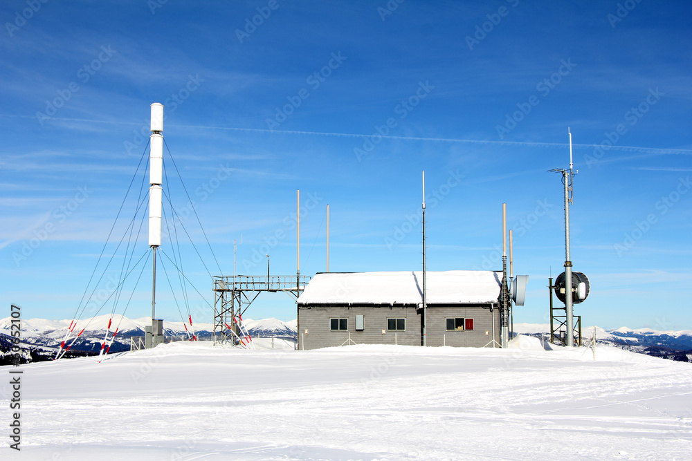 Fototapeta premium Weather station on the mountain, winter and snow