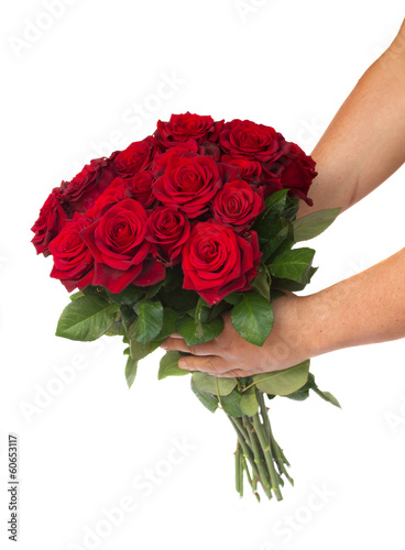 hands holding bouquet of roses