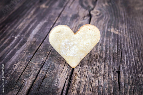 Heart of the cookies and the wooden background.
