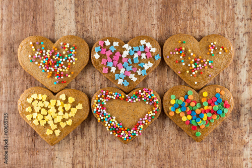 Heart shaped valentine cookies on a wooden board