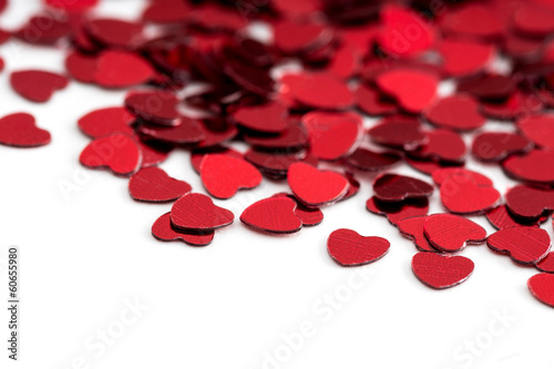 Valentines decoration of red confetti hearts against