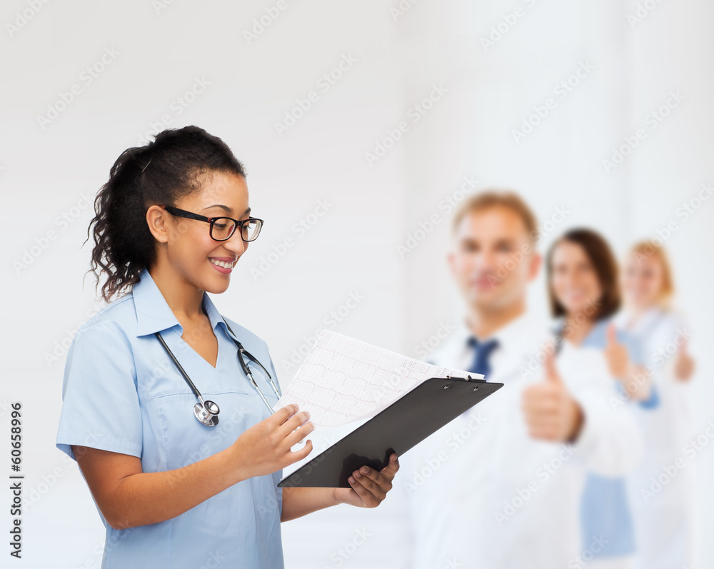 smiling female african american doctor or nurse smiling female african american doctor or nurse
