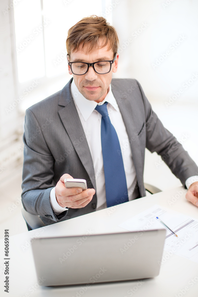 businessman working with laptop and smartphone businessman working with laptop and smartphone