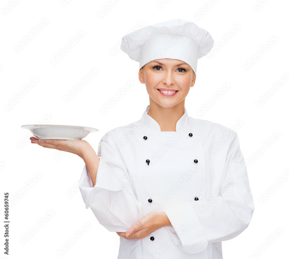 smiling female chef with empty plate smiling female chef with empty plate