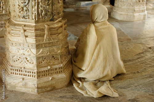 Praying monk insaid the Jain temple in India