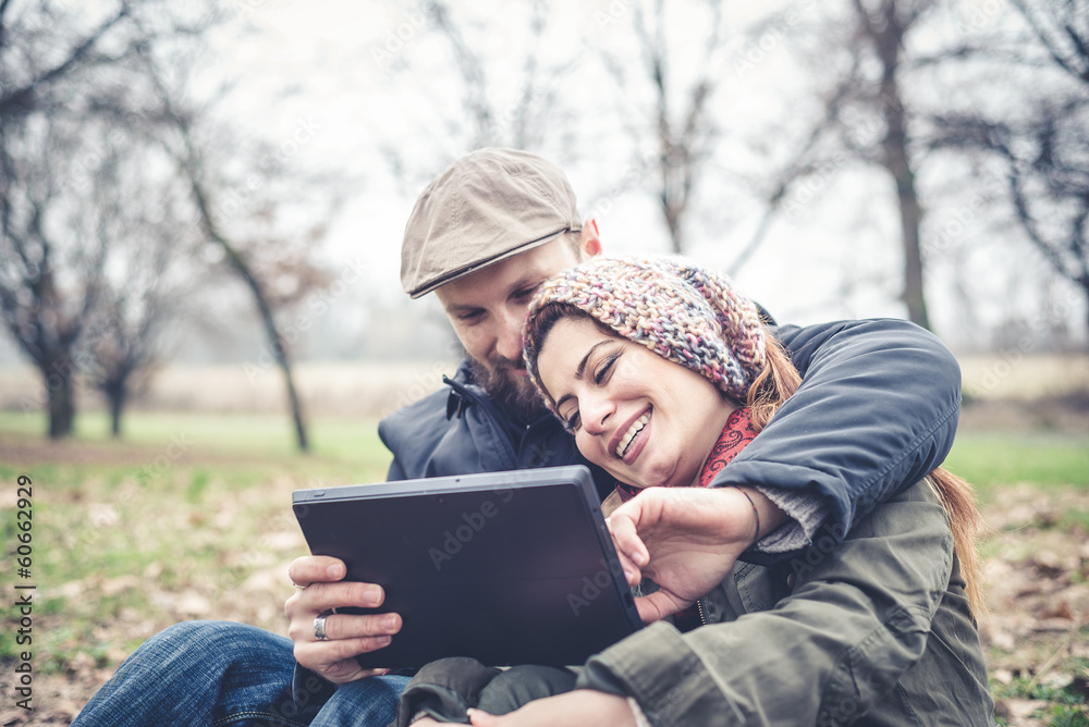 couple in love using tablet connecting web wireless wifi couple in love using tablet connecting web wireless wifi