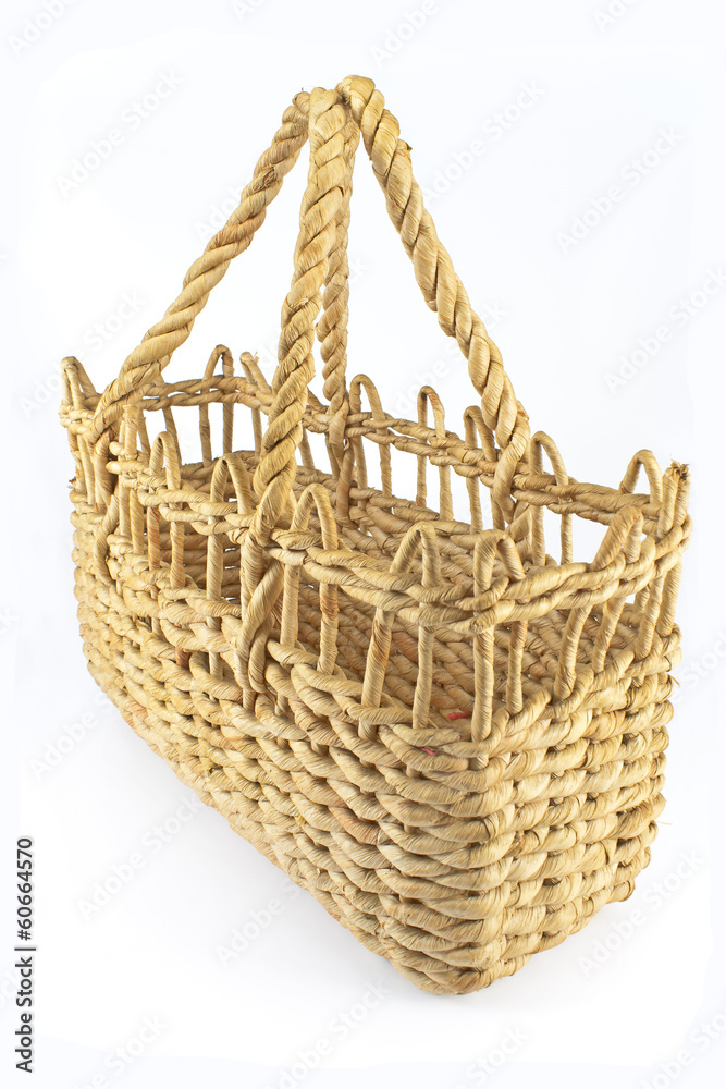 Obraz premium Straw shopping basket isolated on white