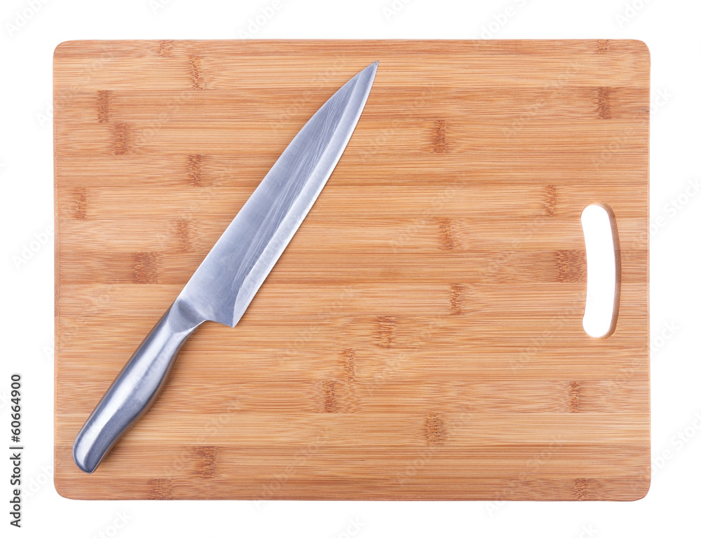 Kitchen cutting board and a large kitchen knife. Close-up.