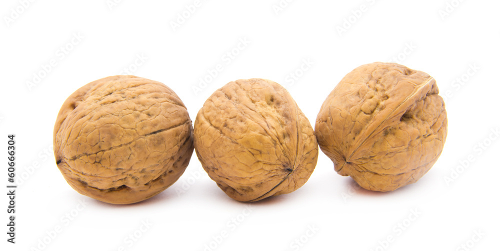 walnut and a cracked walnut isolated on the white background
