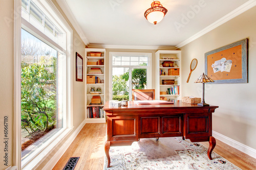 фотографія Bright office room with classic desk and built-in shelves