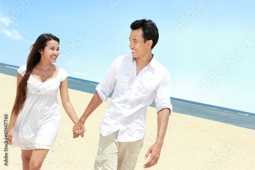 couple enjoying the beach © Odua Images