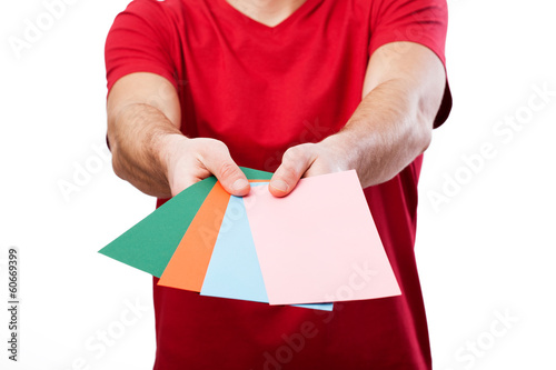 Man holding colorful cards for your own text