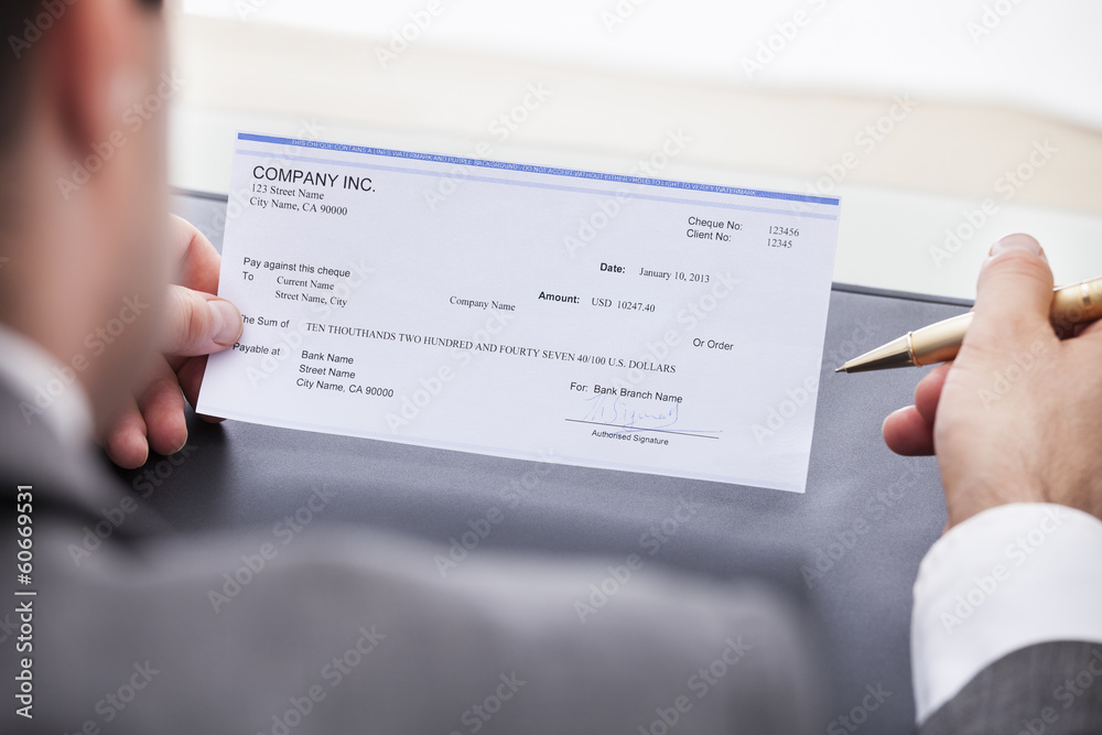 Businessman Filling Cheque