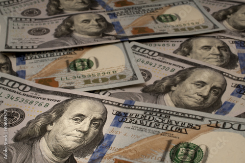 One Hundred Dollar bills with Benjamin Franklin highlighted