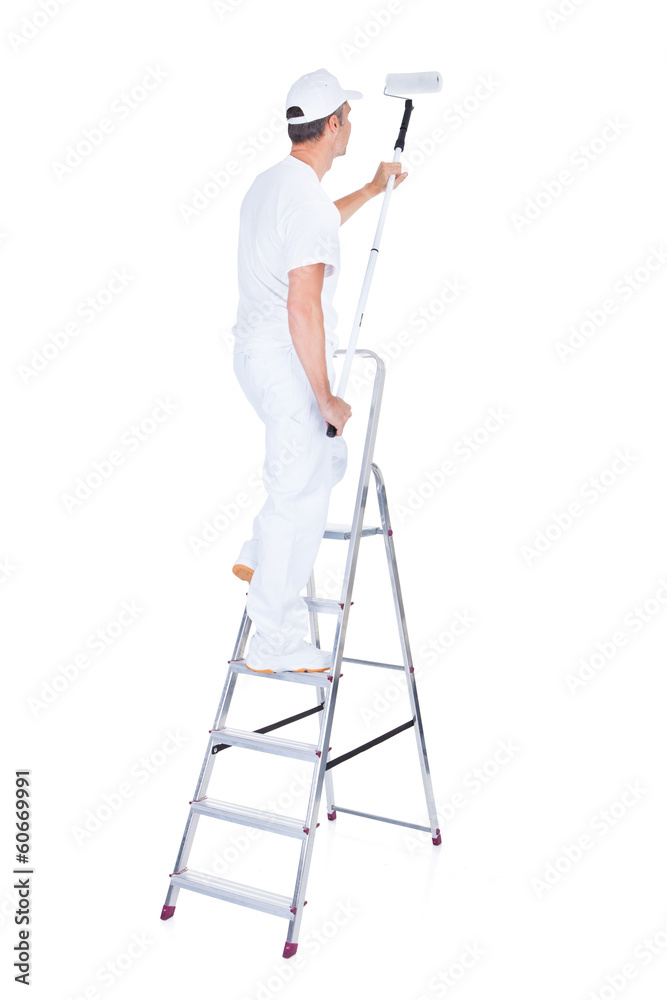 Fototapeta premium Painter With Paint Roller And Ladder