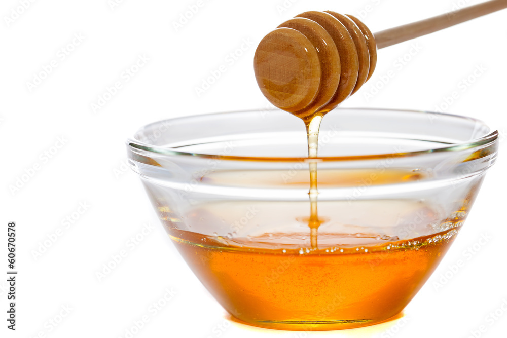 Honey with dipper and glass bowl Honey with dipper and glass bowl