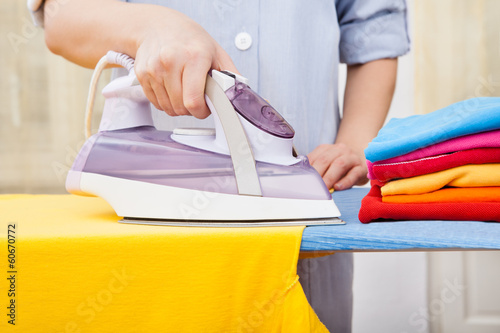 Maid Ironing Clothes