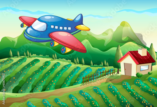 An airplane above the farm with a house