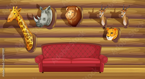 A wall with stuffed head decorations