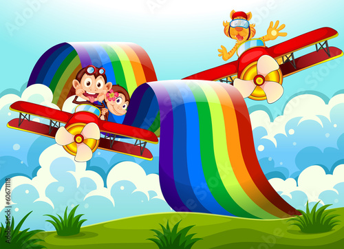 Playful animals near the rainbow above the hills