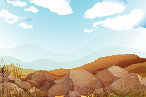 Big brown rocks under the blue sky