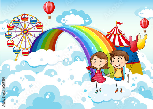 A carnival in the sky with a rainbow
